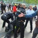 picture of the violent police arrests at Luxemburg during the march for freedom